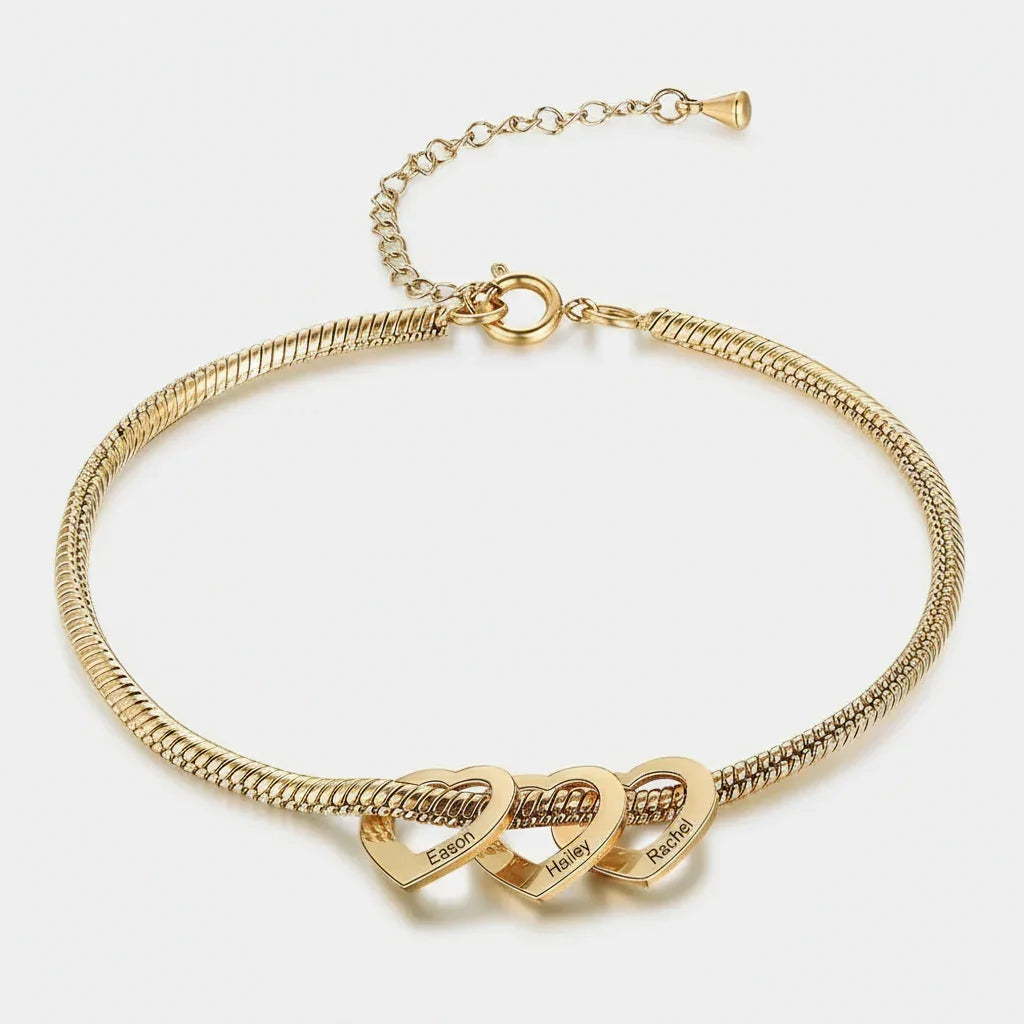 gold bracelet with three linked heart pendants engraved with names Eason, Hailey, and Rachel