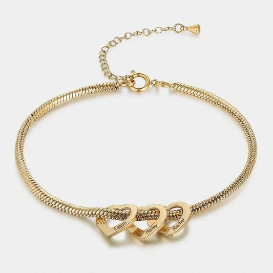 gold bracelet with three linked heart pendants engraved with names Eason, Hailey, and Rachel